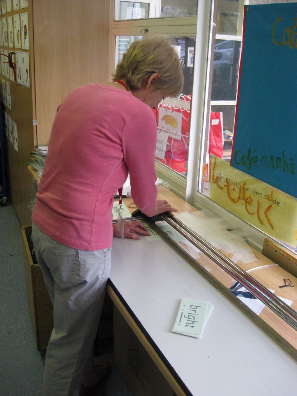  volunteer helps with a classroom display